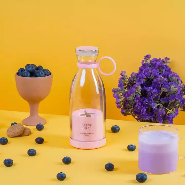 Pink bottle labeled 'Fresh Juice' with blueberries, a glass of purple juice, and flowers on a yellow background.